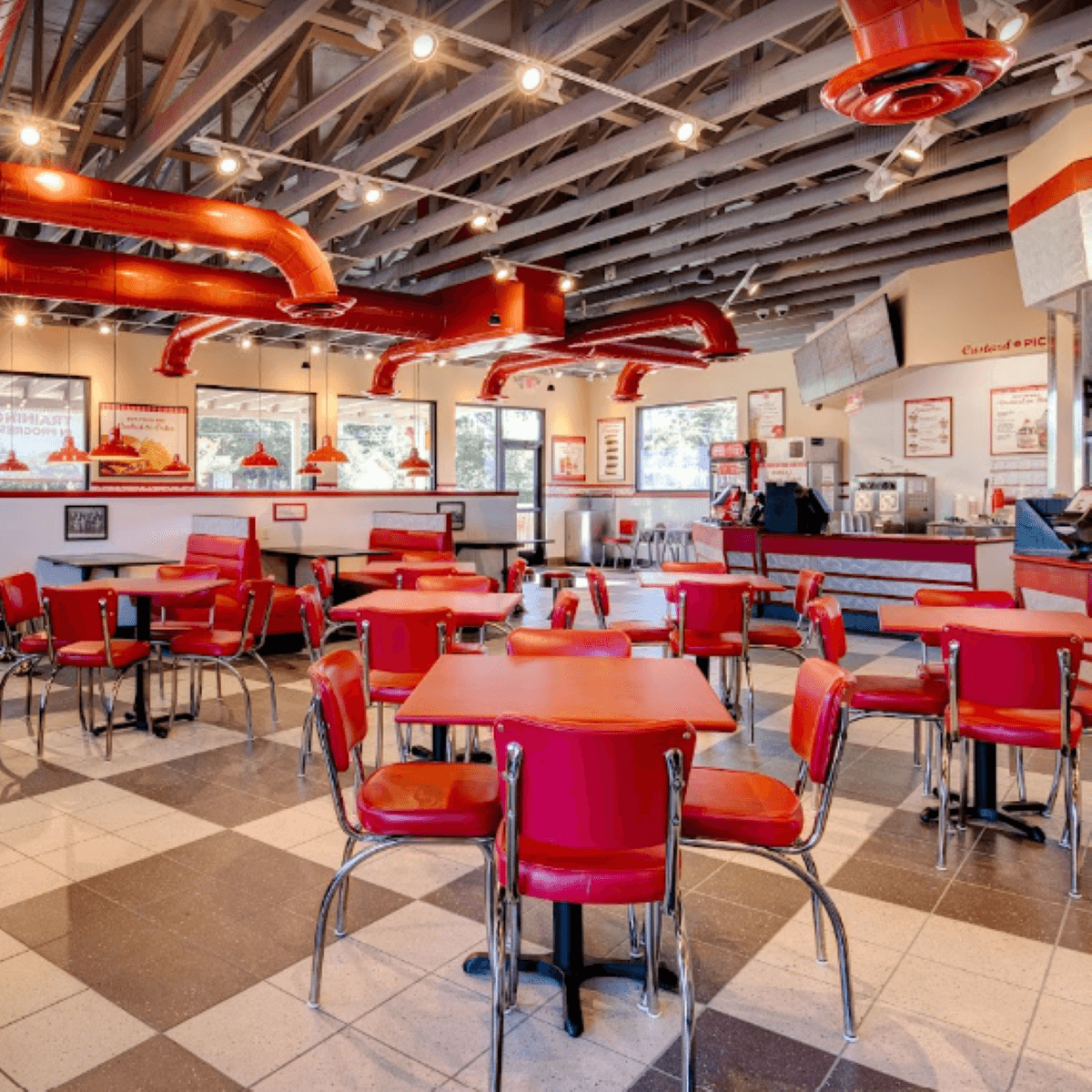 The red vintage diner themed interior of a freddy's that opened in summerville in 2021