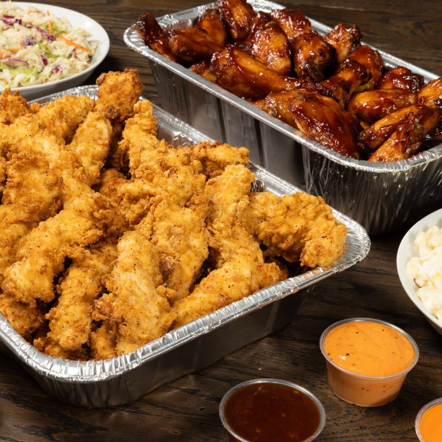 A tray of slim chickens tenders and wings along with sauces that will be served at the new Moncks Corner location of the restaurant near Charleston