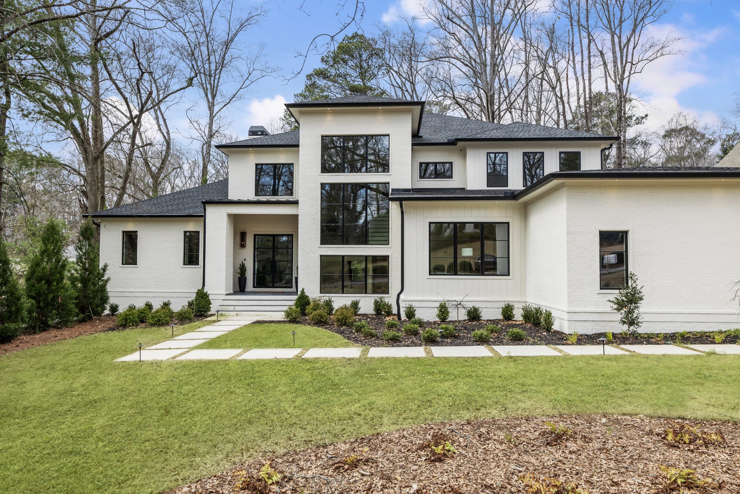 A Chastain Park New Build with Main-Level Suites and Glass Wine Showcase